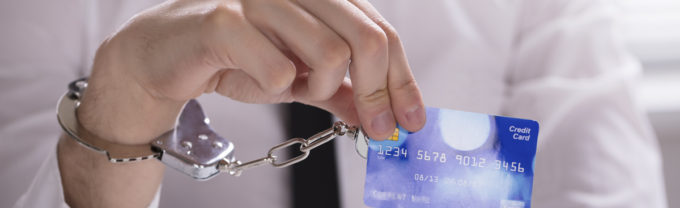 Person handcuffed to a credit card